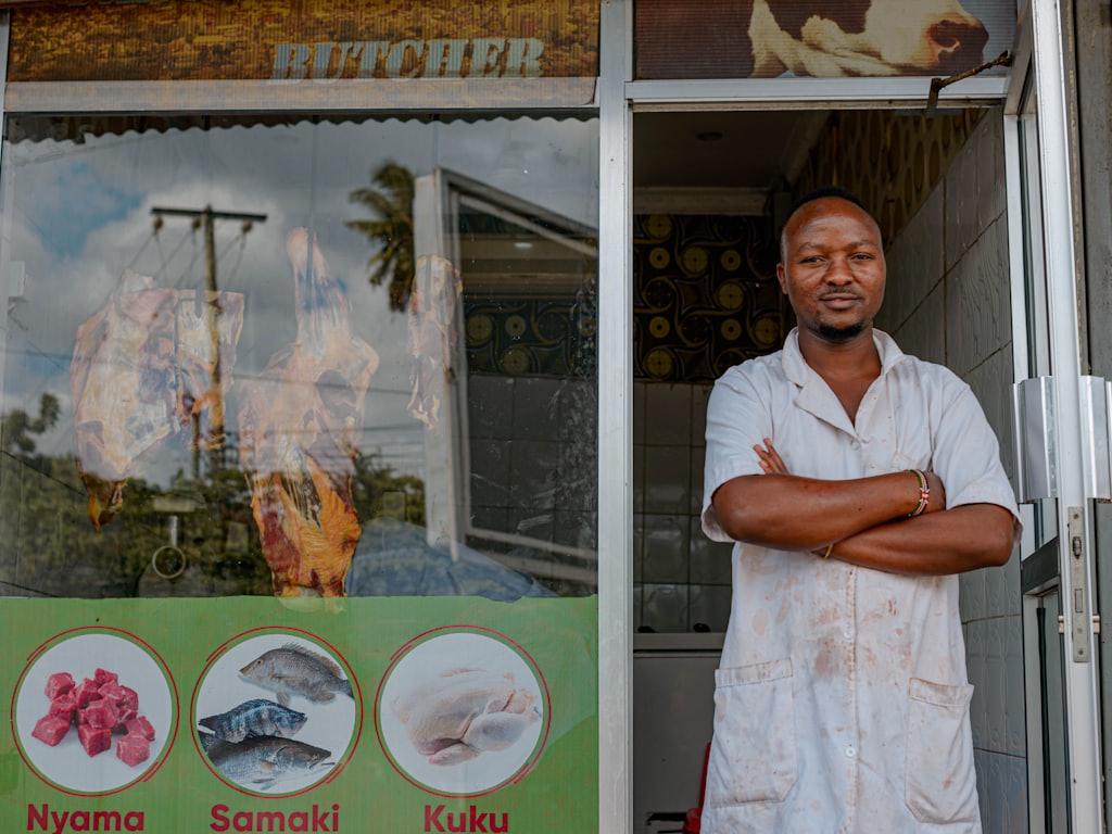 A local business owner outside their shop